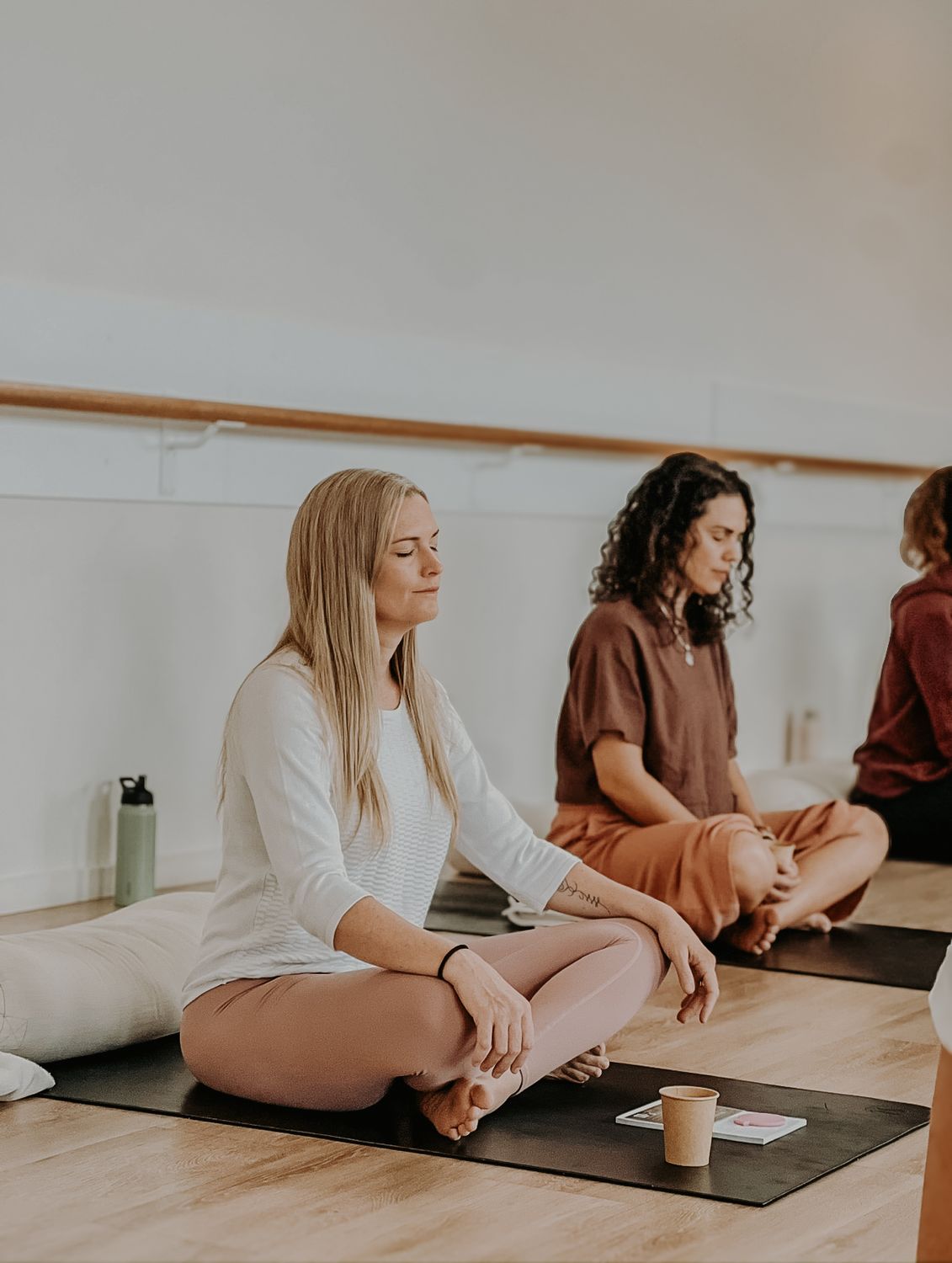 Women meditating in a studio